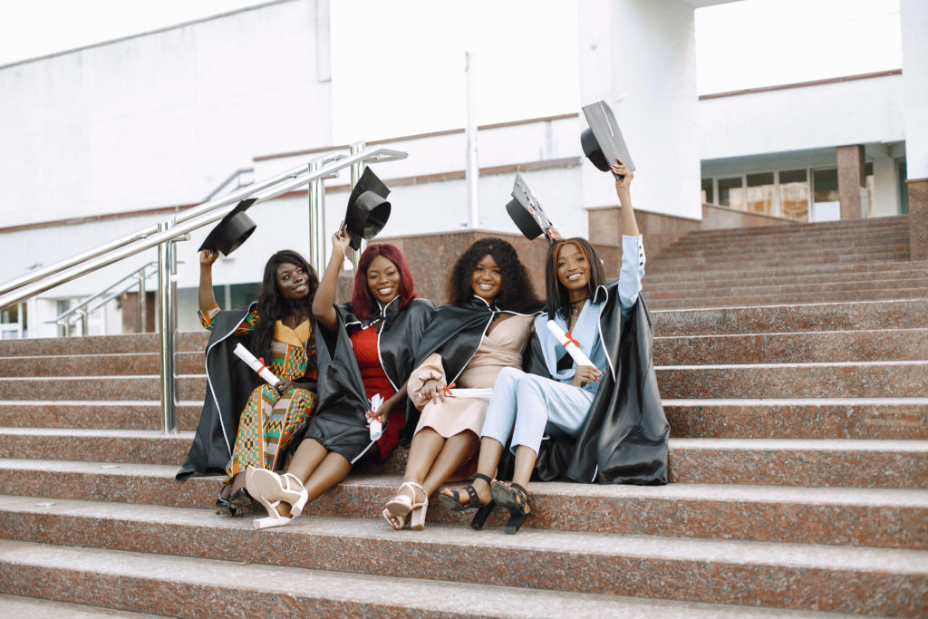Four african american female students at their graduation.